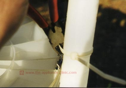 Cut overflow tube tie wrap